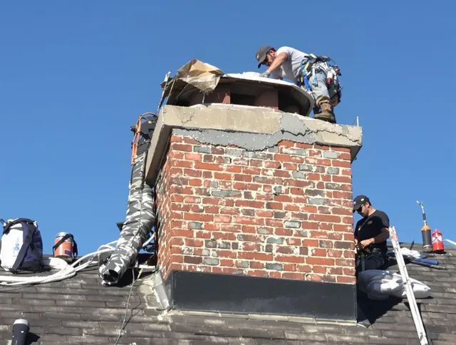Columbus Chimney Sweep installing a custom chimney crown in Columbus, OH