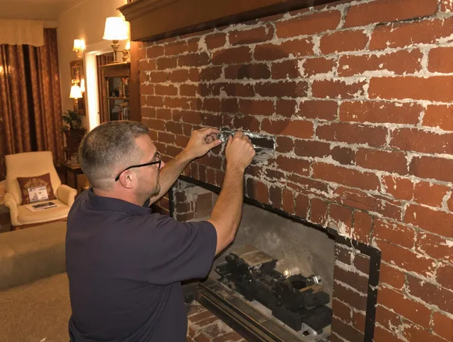 Columbus Chimney Sweep expert fixing a fireplace in Columbus, OH